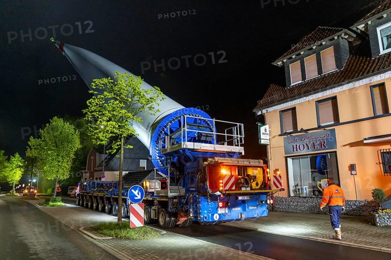 Transport of a 68 metre long, 22 tonne blade of a wind turbine, here in Breckerfeld-Waldbauer, with a self-propelled Blade-Lifter vehicle, over a 40 km long route, over 2 nights, in the Bergisches Land, through towns, villages, on country roads, narrow through roads, to the construction site of the wind turbine near Hagen, North Rhine-Westphalia, Germany, Europe