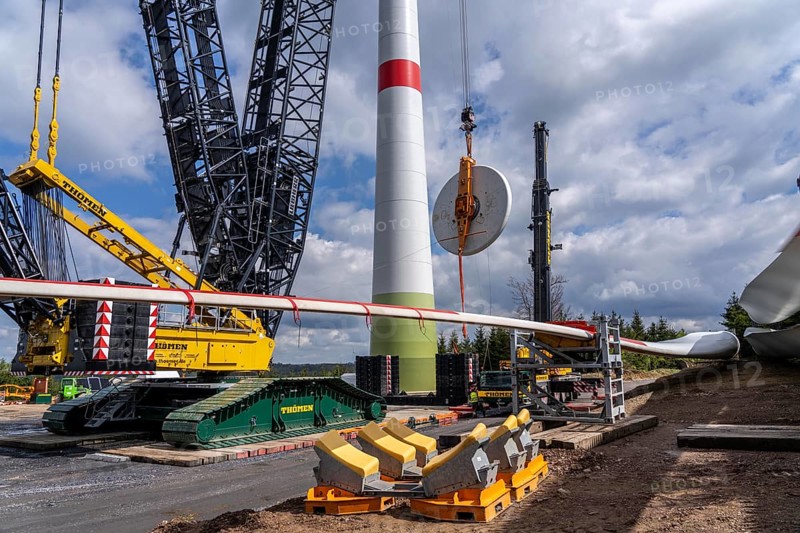 Erection of a wind turbine, wind energy plant, assembly of the ring generator, with a crawler lattice crane, wind farm near Hagen, North Rhine-Westphalia, Germany, Europe