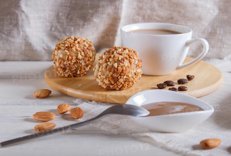 Energy balls cakes with nuts on wooden board on linen napkin. selective focus, close up