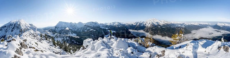 Panorama, mountaineer on the snowy summit of the Jenner in autumn, view of the sea of clouds and Hagengebirge and Watzmann, Sonnenstern, Berchtesgaden National Park, Berchtesgaden Alps, Schönau am Königssee, Berchtesgadener Land, Bavaria, Germany, Europe