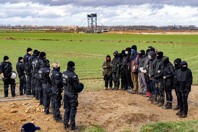 Start of the eviction of the hamlet Lützerath at the lignite mine Garzweiler 2, activists try to obstruct the preparation for the upcoming eviction of the site, which is occupied by climate protection activists, the energy company RWE prepares the construction of work roads, protected by the police, North Rhine-Westphalia, Germany, Europe