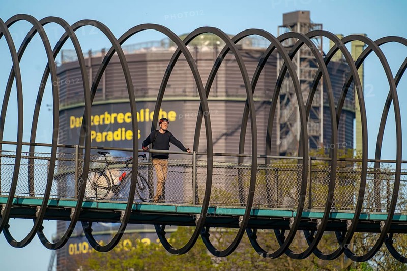 Bridge Slinky Springs to Fame, Gasometer, Cycling in the Ruhr area, Halde Franz, Haldenzeichen, orange, snail shell-shaped observation tower, Hamm, North Rhine-Westphalia, Germany The Gasometer Oberhausen, Slinky Springs to Fame Bridge over the Rhine-Herne Canal, North Rhine-Westphalia, Germany, Europe