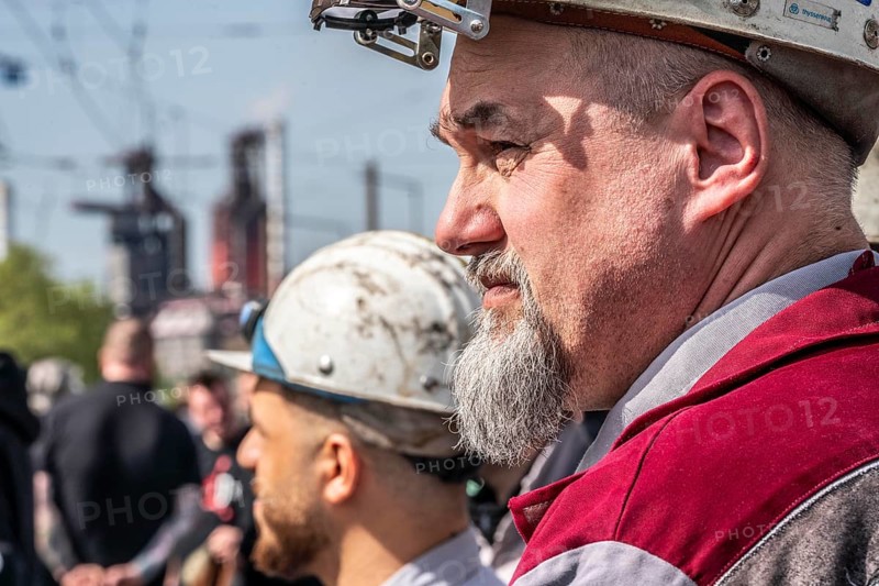 Steelworkers at a demonstration in front of the headquarters of ThyssenKrupp Steel Europe in Duisburg, against massive job cuts, after the participation of a foreign investor in the group, in the background the blast furnaces 8 and 9, Duisburg North Rhine-Westphalia, Germany, Europe