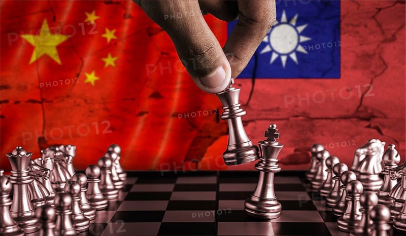 China vs Taiwan flag concept on chessboard. Political tension between China and Taiwan on pieces of chessboard