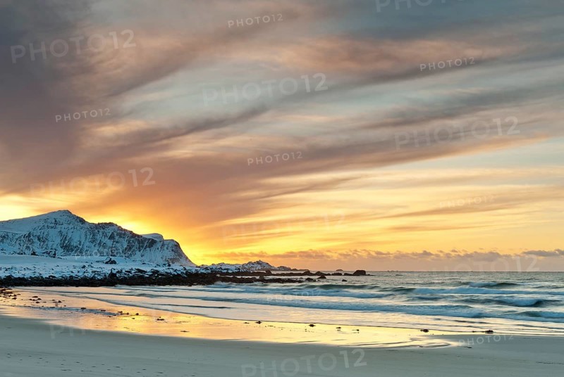 Sunset in winter at Skagsanden, stones on the beach at Flakstad, Flakstadøy, Lofoten, Nordland, Norway, Europe