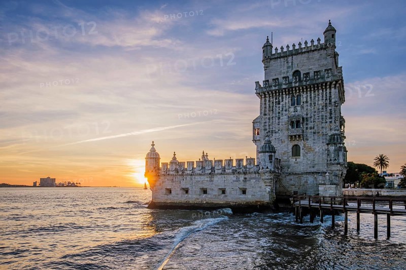 Belem Tower or Tower of St Vincent, famous tourist landmark of Lisboa and tourism attraction, on the bank of the Tagus River Tejo on sunset. Lisbon, Portugal, Europe