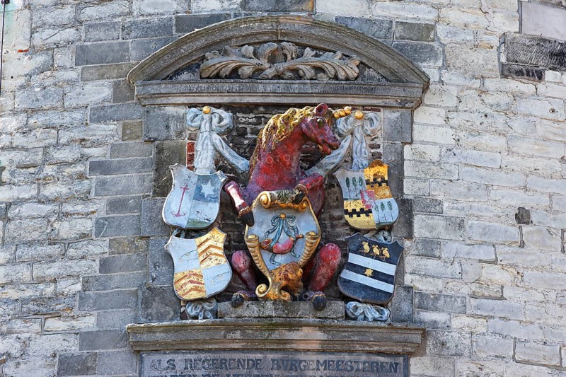 City coat of arms with unicorn on the historic Hoofdtoren defence defence tower in the harbour of Hoorn, Markermeer, part of the IJsselmeer, province of North Holland, West Friesland, Netherlands