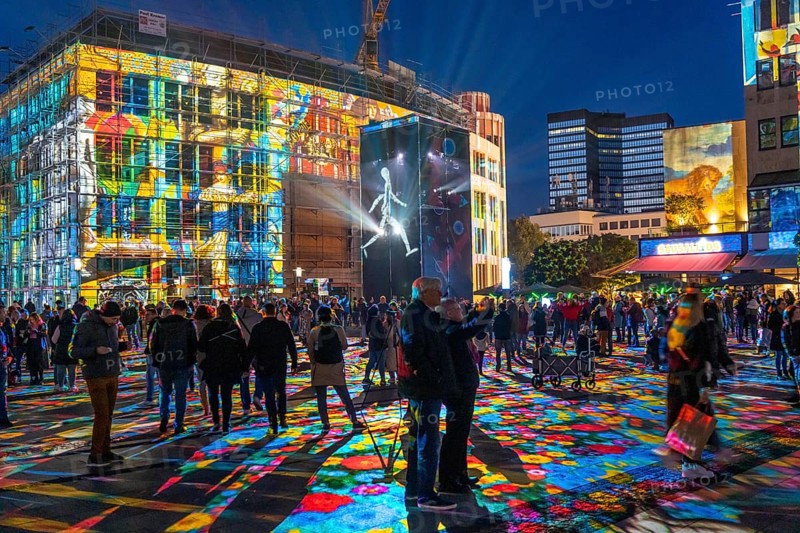 Essen Light Festival, in the city centre, light art on Kennedyplatz, the Berlin artist Daniel Margraf illuminates the large square in the city centre with works of art from the Essen Folkwang Museum, the visitors become part of the pictures that change with every step. North Rhine-Westphalia, Germany, Europe