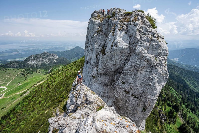 Climber with climbing rope on a climbing tour, climber on a mountain ridge, alpine climbing, crossing the Kampenwand, Chiemgau, Bavaria, Germany, Europe