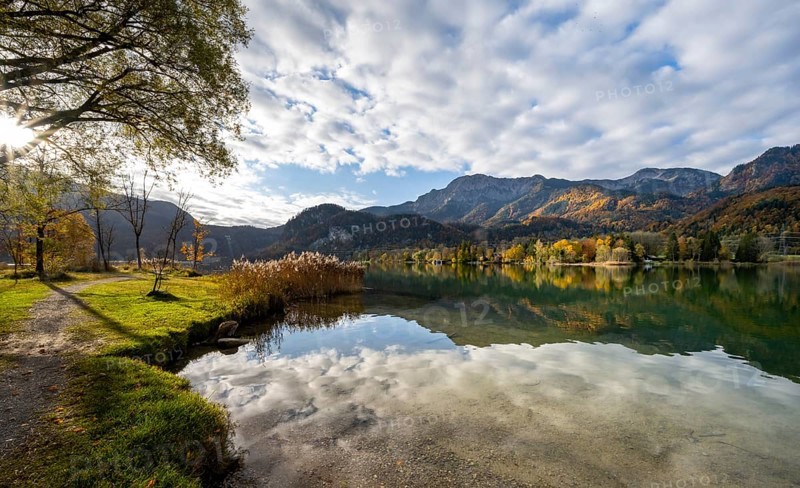 On the shore of Lake Lake Kochel with reflection, autumn landscape with mountain peaks Herzogstand and Heimgarten, Upper Bavaria, Bavaria, Germany, Europe