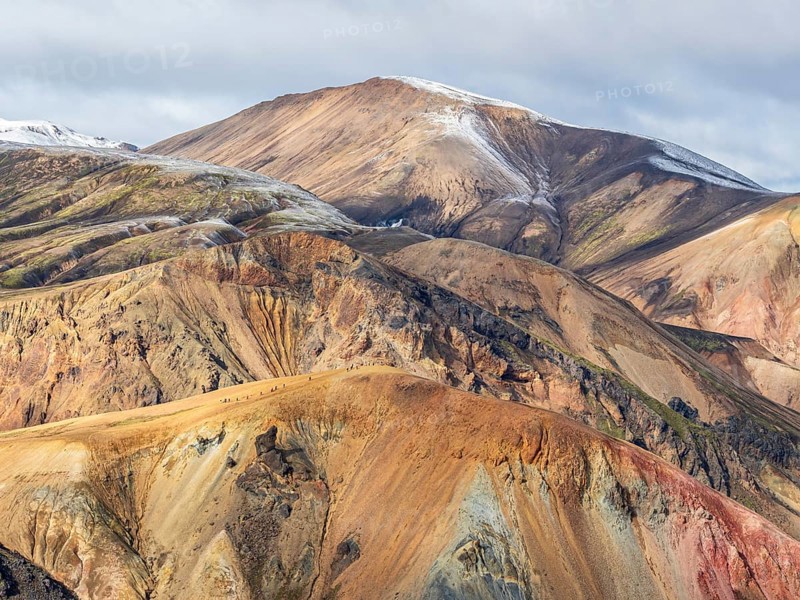 Early snow on the colorful rhyolite mountains, mt. Brennisteinsalda, lava fields, Landmannalaugar, Fjallabak Nature Reserve, Iceland, Europe