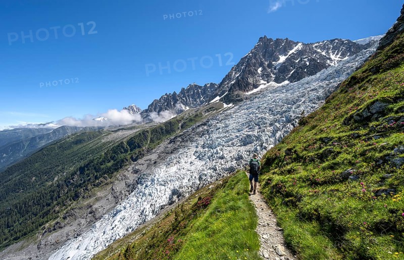 Hiking on the trail to La Jonction, Glacier des Bossons, behind the summit of the Aiguille du Midi, Chamonix, Haute-Savoie, France, Europe