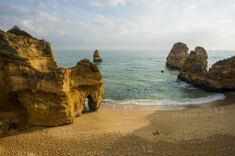 Rocky coast with beach and red rocks, Praia do Camilo, Lagos, Algarve, Portugal, Europe