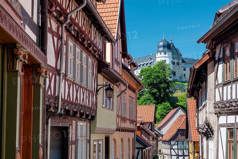 Street with half-timbered houses in the old town, the castle in the background, Stolberg im Harz, Saxony-Anhalt, Germany, Europe