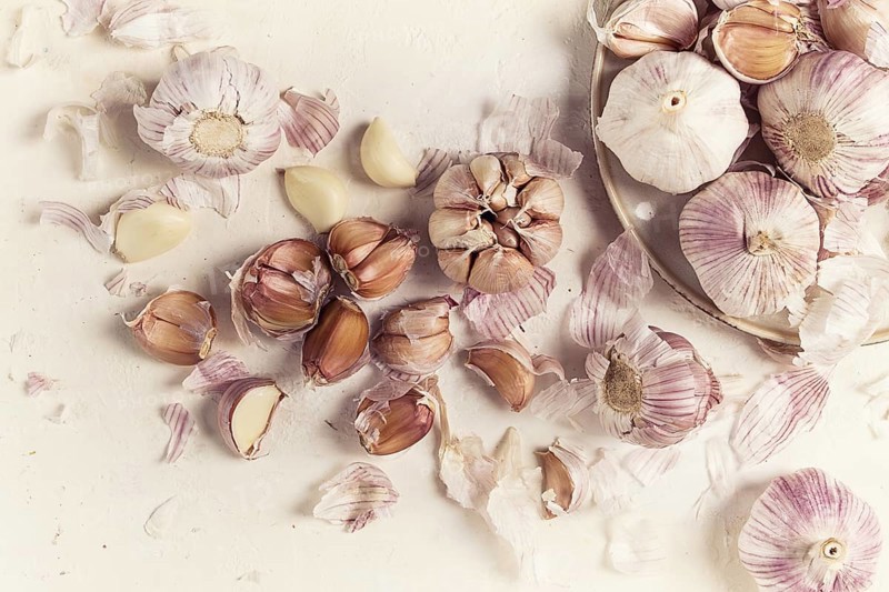 Fresh garlic on a white background, top view, food concept