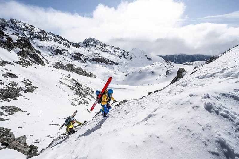 Climbers with skis ascending a steep snow slope to the Porta d'Es-cha saddle, Bündner Haute Route ski tour, Albula Alps, Rhaetian Alps, Grisons, Eastern Switzerland, Switzerland, Europe