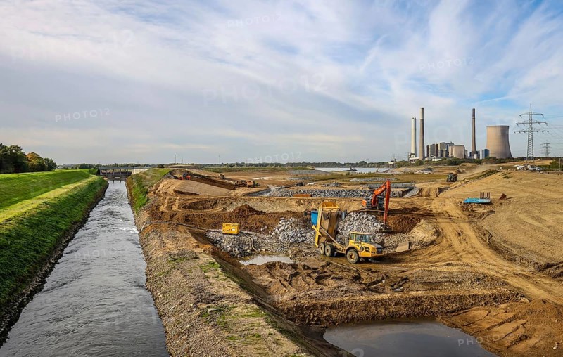 Dinslaken, Voerde, North Rhine-Westphalia, Germany, Emscher estuary into the Rhine. Construction site of the new Emscher estuary in front of the decommissioned STEAG coal-fired power station in Voerde. The mouth of the Emscher into the Rhine is being moved almost 500 metres north from Dinslaken to Voerde. Fish will then be able to swim barrier-free up the new Emscher from the Rhine through a newly created floodplain area. Following the construction of a parallel sewer, the Emscher has been completely free of sewage since January 2022. The river was previously an open, above-ground combined sewer with rainwater and wastewater. The old Emscher on the left. On the right, the new Emscher main course. Flood protection through wide outlet areas in the new river delta, Europe