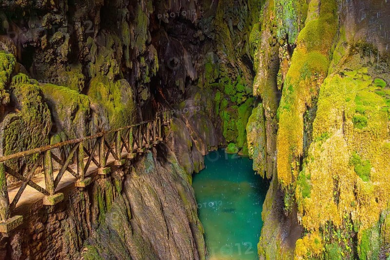 Beautiful colours inside the Iris Grotto at the Cola de Caballo Waterfall in the Monasterio de Piedra Natural Park, Aragon