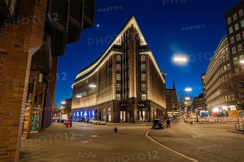 Chilehaus at night, viewed from below, brick façade illuminated, lettering visible, Hamburg, Germany, Europe