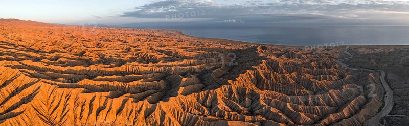 Landscape of eroded hills at Lake Issyk Kul, Badlands at sunrise, aerial view, Canyon of the Forgotten Rivers, Issyk Kul, Kyrgyzstan, Asia