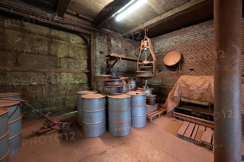 Metal barrels in the bronze powder filling room of a metal powder mill, founded in 1900, Igensdorf, Upper Franconia, Bavaria, Germany, Europe