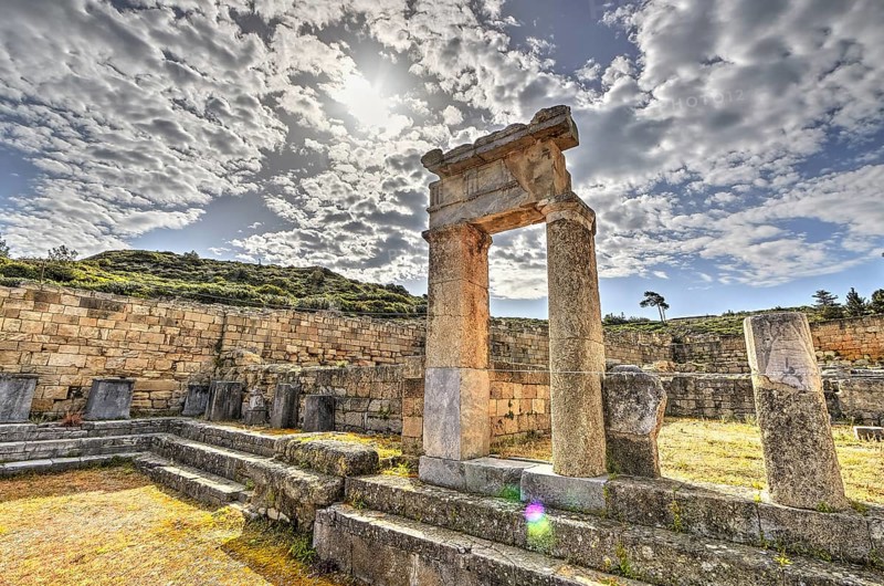 HDR, Super wide angle shot, Ancient ruins with stone walls and columns under a sunny sky with clouds, historical site, Ancient well house, Kamiros, Archaeological site, Ancient city, Foundation of Doric Greeks, Rhodes, Dodecanese, Greek Islands, Greece, Europe