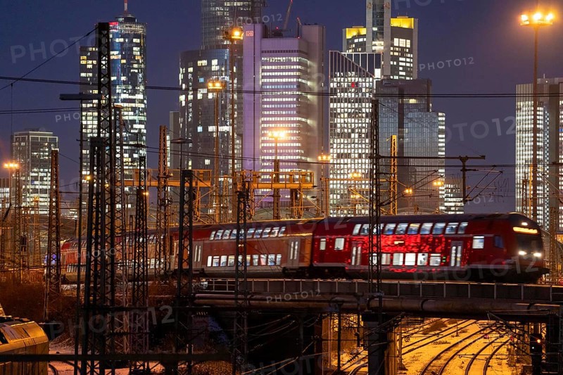 Railway tracks in front of the main railway station in Frankfurt am Main, skyline of skyscrapers in the Cit, winter, snow, dusk, Hesse, North Rhine-Westphalia