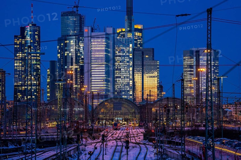 Railway tracks in front of the main railway station in Frankfurt am Main, skyline of skyscrapers in the Cit, winter, snow, dusk, Hesse, North Rhine-Westphalia