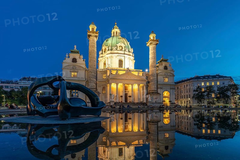 Sculpture by Henry Moore Hill Arches and the Karlskirche in Vienna at dusk, Austria, Europe