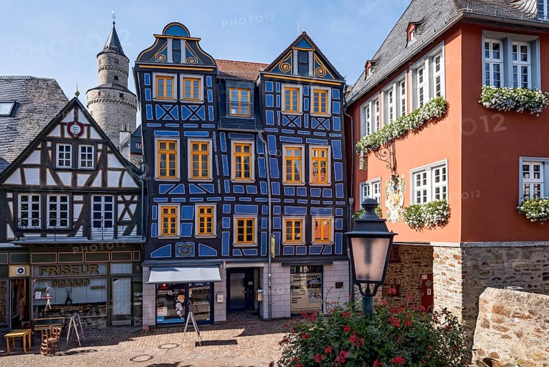 The leaning house, half-timbered house, colourfully painted, witches' tower, town hall, King Adolf Square, historic old town, Idstein, Rheingau Taunus district, German Half-Timbered House Route, Hesse, Germany, Europe