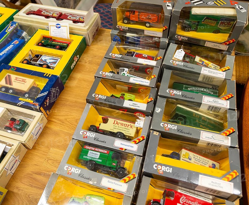 Boxes of Corgi model trucks, vans and other vehicles on display at auction, UK