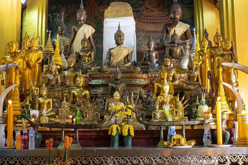 Numerous Buddhas and the city pillar, which is considered the home of the city's protective spirit, Wat Si Muang temple complex, Vientiane, Laos, Asia