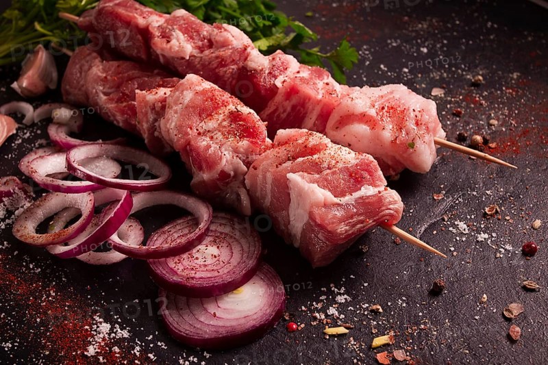 Raw pork meat, pickled kebab, with spices, top view, no people