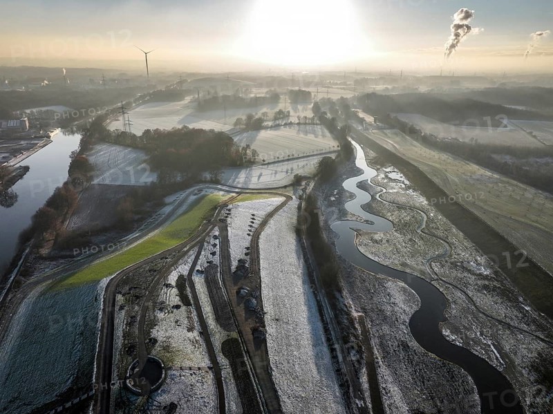 Recklinghausen, Castrop-Rauxel, North Rhine-Westphalia, Germany, winter landscape, EMSCHERLAND construction project, a 37-hectare water and nature discovery park at the water crossroads of the Rhine-Herne Canal (left) and the renaturalised Emscher (right) on the city limits of Recklinghausen and Castrop-Rauxel. The ecological focus at the confluence of the Suderwicher Bach (far right) and Emscher will also be a future garden for the International Garden Exhibition 2027. Before the renaturalisation, the Emscher river system was an open, above-ground wastewater channel, combined sewer with surface water and wastewater, Europe