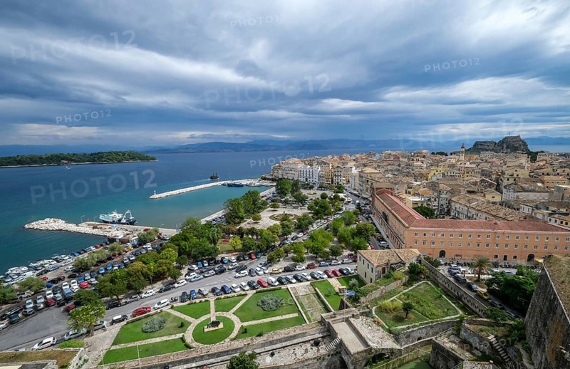 Corfu Town, Corfu, Greece, City overview Corfu Town with the Old Harbour, the Greek Orthodox Church of Agios Spiridon and the New Fortress. Behind mainland Albania, Europe