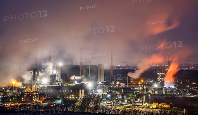 Bottrop, North Rhine-Westphalia, Germany, The Prosper coking plant is one of three operating coking plants in the Ruhr area. The Prosper coking plant is the last coking plant to be operated by the successor company to Ruhrkohle AG, RAG Deutsche Steinkohle AG. It was taken over by the steel group ArcelorMittal in 2011. The coking plant is designed for an annual production of almost two million tonnes of coke. At the back right, the skyline of Essen city centre, Europe