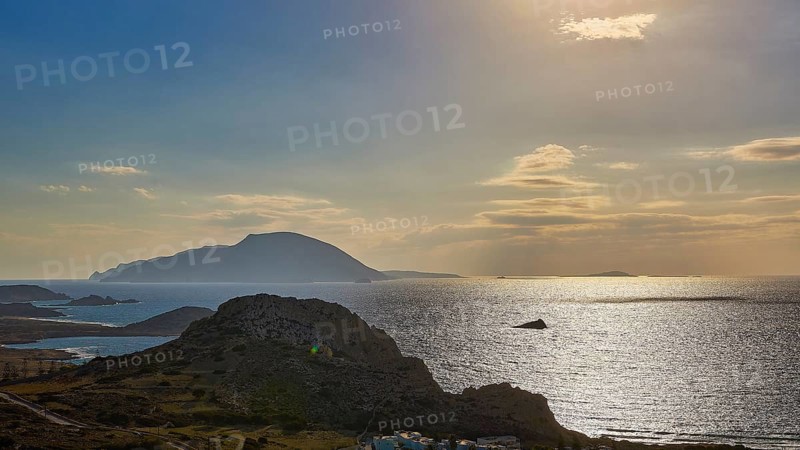 Glittering sea in front of islands in the evening light with dawning sky, Arkasa, west coast, Kassos Island, Karpathos, Dodecanese, Greek Islands, Greece, Europe