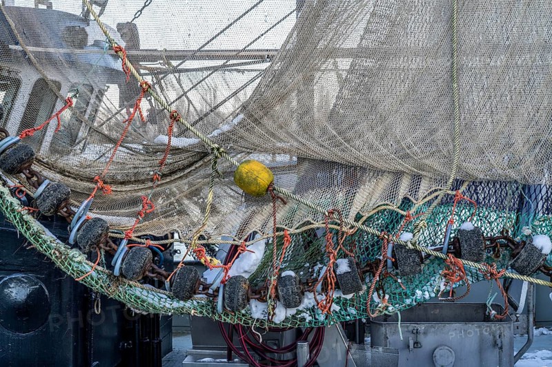 The fishing village of Greetsiel, historic fishing harbour, with the largest shrimp cutter fleet in East Frisia, fishing nets, fishing nets, winter, Lower Saxony, Germany, Europe