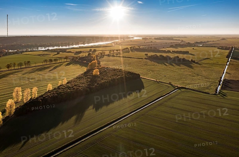 Aerial view of farmland and river Elbe near Lenzen, view to Höhbeck radio mast, sunset, Germany, Europe
