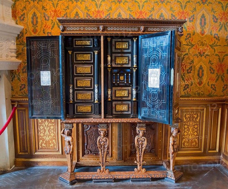 Decorative antique wooden cabinet with detailed engraving and open doors, Italian cabinet in the Salon de Francoir ler, Chenonceau Castle, Château de Chenonceau, moated castle, Chenonceaux, Indre-et-Loire, Centre-Val de Loire, France, Europe