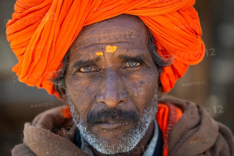 Man with orange turban and yellow bindi on his forehead, portrait, Chittorgarh Fort, Chittorgarh, Rajasthan, India, Asia