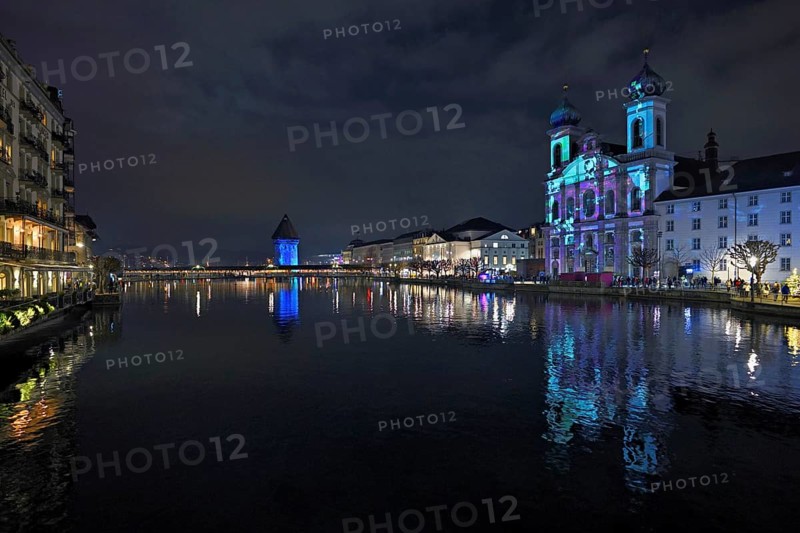 Water tower and Jesuit church on the right with light installation, on the Reuss at dusk, Old Town, Lilu, Light Festival 2025, Lucerne, Canton of Lucerne, Switzerland, Europe