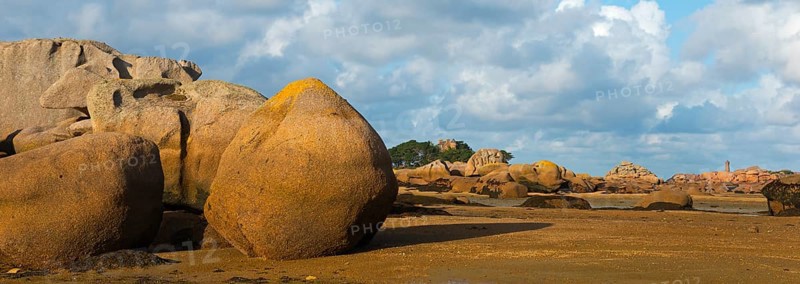 Large rocks on the beach under a cloudy blue sky, Baie de Sainte-Anne, Trégastel, Tregastel, Côte d'Armor, Brittany, France, Europe