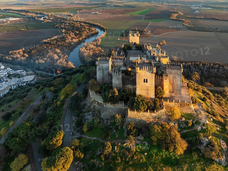 The impressive eighth-century Moorish castle of Almodóvar del Río perches high above the Guadalquivir river valley. Aerial view. Drone shot. Córdoba province, Andalusia, Spain, Europe