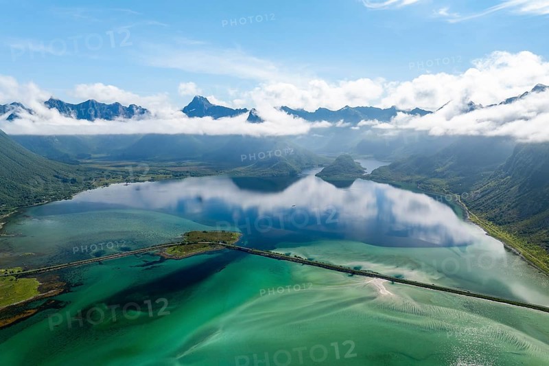 Fjord and mountains of the island Austvågøya, road on dam, Grunnførfjorden, Lofoten, Norway, Europe