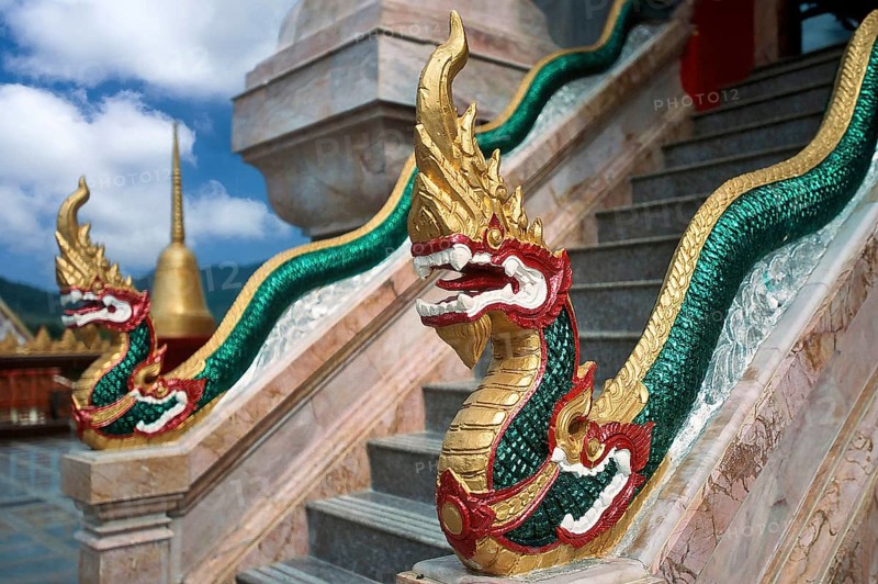Dragon on staircase of tower with top of Chedi highest building in temple complex buddhist monastery Wat Chalong Wat Chaitararam, Phuket, Thailand, Asia