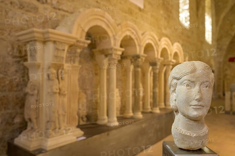 Stone female head in the museum at Gellone Abbey, also Saint-Guilhem-le-Désert Monastery, Département Hérault, France, Europe