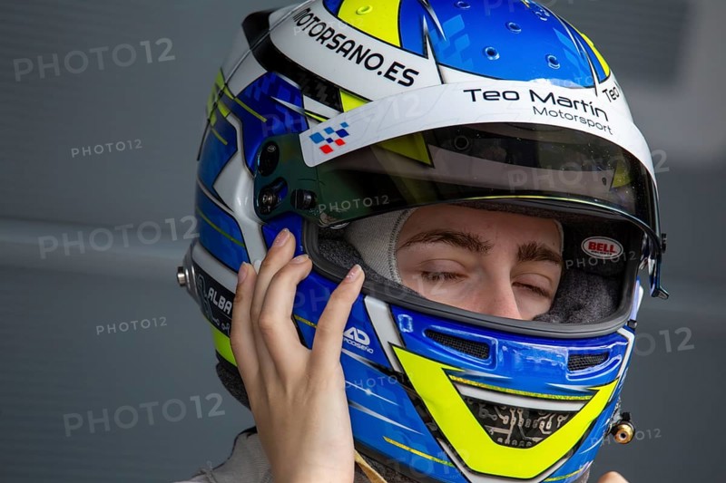 10 May 2024, Hockenheimring Germany : Spanish racing driver Alba Vazquez puts on her helmet and gets ready to get into the cockpit (GT Open)