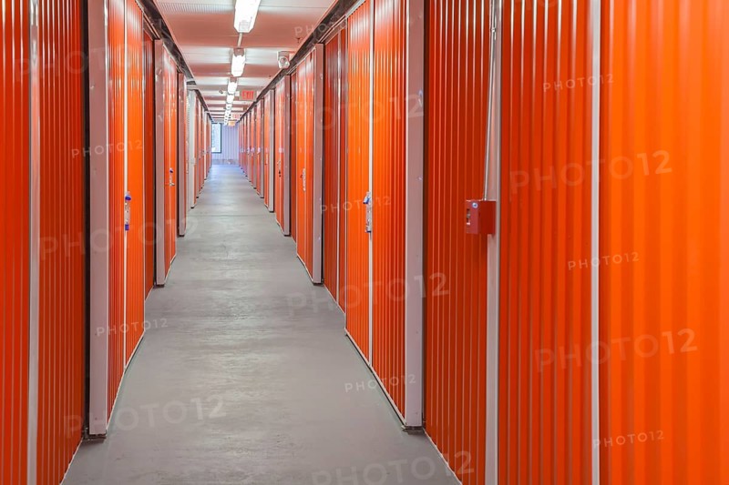 Orange interior of self storage rental units at an enclosed mini warehouse facility in Gulfport, Mississippi, USA, North America