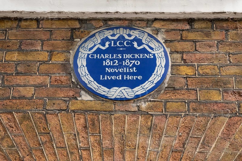 Blue plaque commemorating Charles Dickens on a brick wall, Charles Dickens Museum, 48-49 Doughty Street, Holborn, London Borough of Camden, England, United Kingdom, Europe